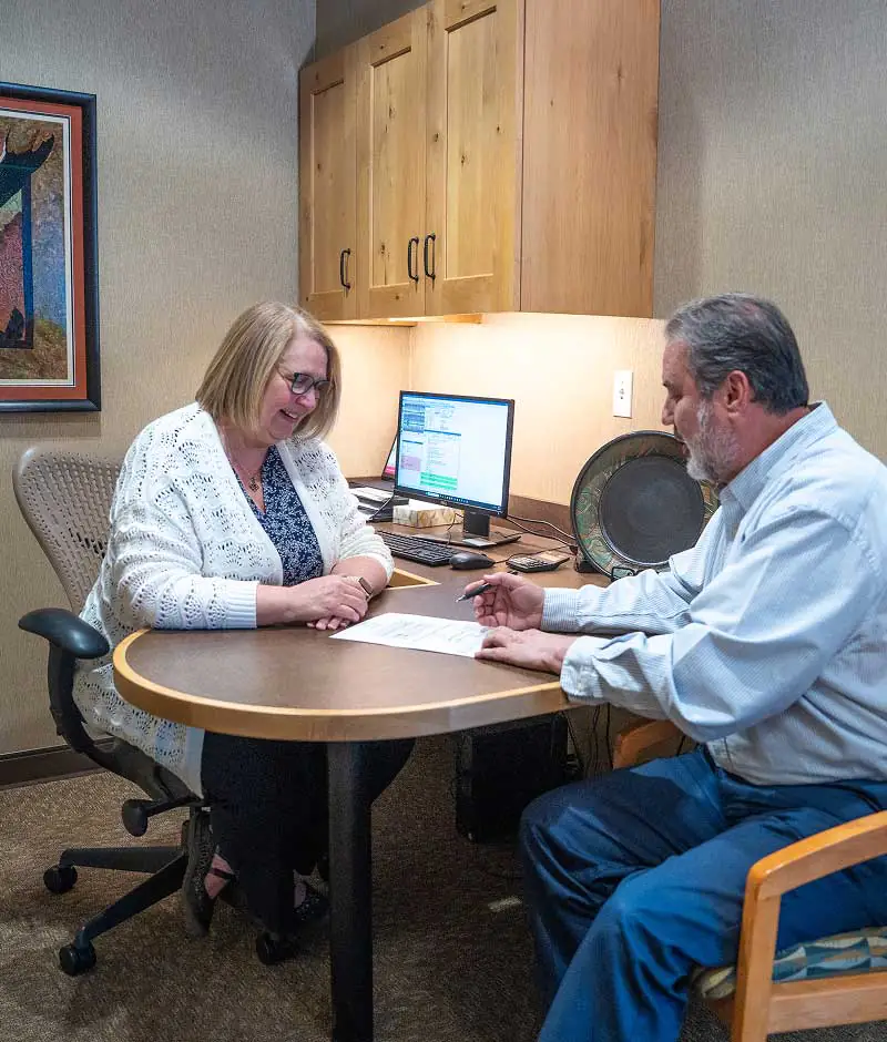 patient going over dental financing options with Great Divide Dental staff